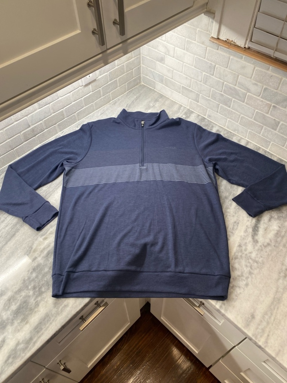 Travis Mathew Navy Quarter-Zip Sweater with Subtle Stripe